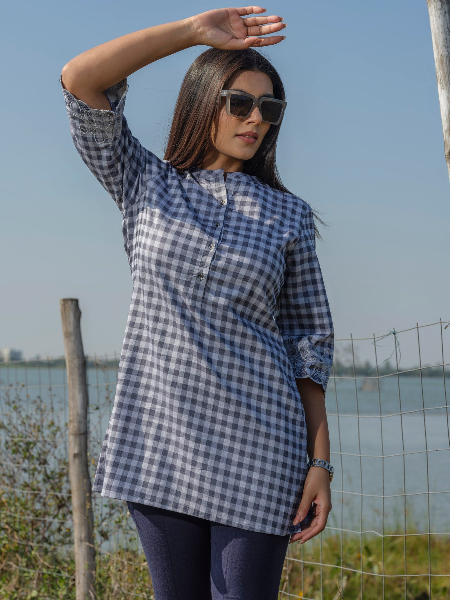 Cotton lycra checks top with cutwork embroidery at sleeves